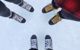 three pairs of skates in a circle on ice pad