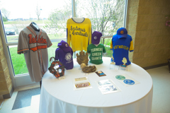 display with jerseys, baseball equipment and photos