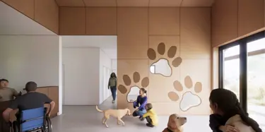 interior lobby with patrons, animals, and paw print decals on wall