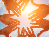 Group of hands in a circle
